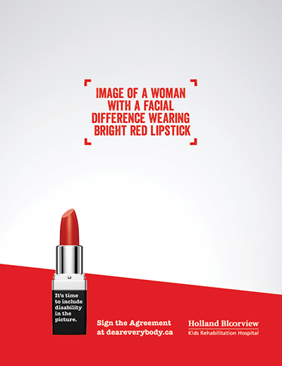 Image of a woman with a facial difference wearing bright red lipstick